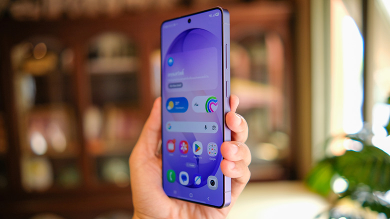 A hand holding up the Samsung Galaxy S26 Ultra
