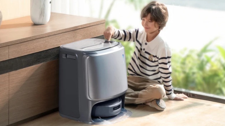 Kid touching Narwal Freo Z10 Ultra Robot Vacuum and Mop