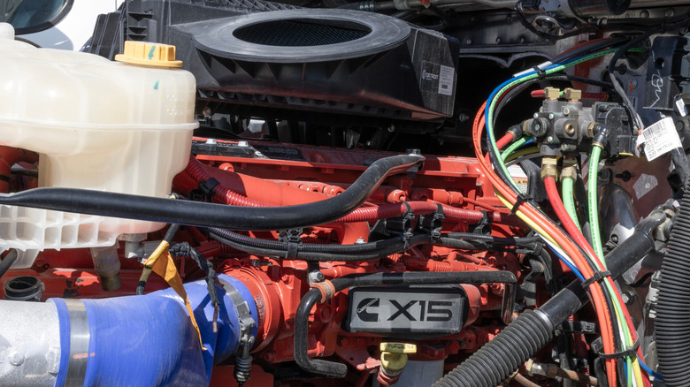 Cummins X15 diesel fitted inside truck, left-side view showing X15 logo