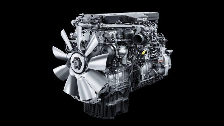 Next-generation Detroit DD15 engine isolated on black background