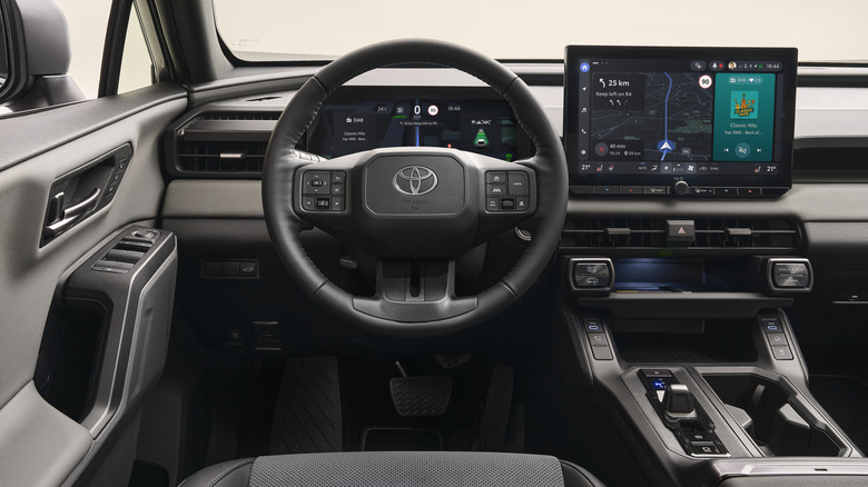2026 Toyota RAV4 dashboard with 12.3-inch digital instrument cluster and large 12.9-inch screen