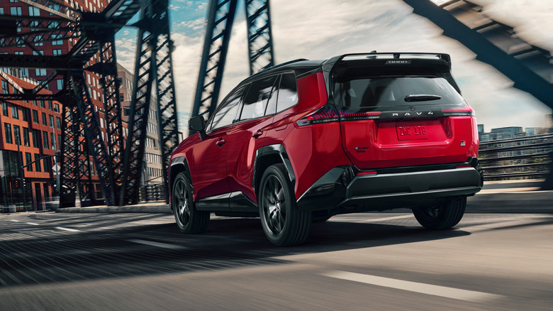 2026 Toyota RAV4 GR Sport PHEV dynamic image on a bridge rear 3/4 view