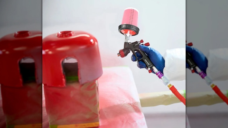 person using spray gun