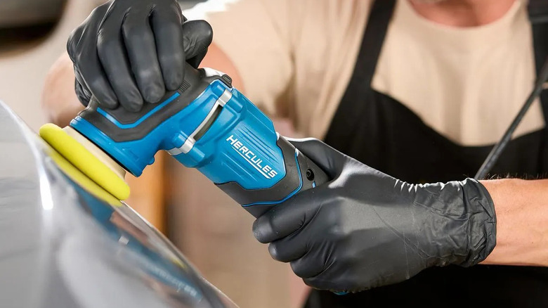 Man using a Hercules random orbit polisher