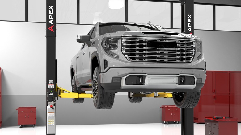 A truck lifted by BendPak Apex two-post lift.