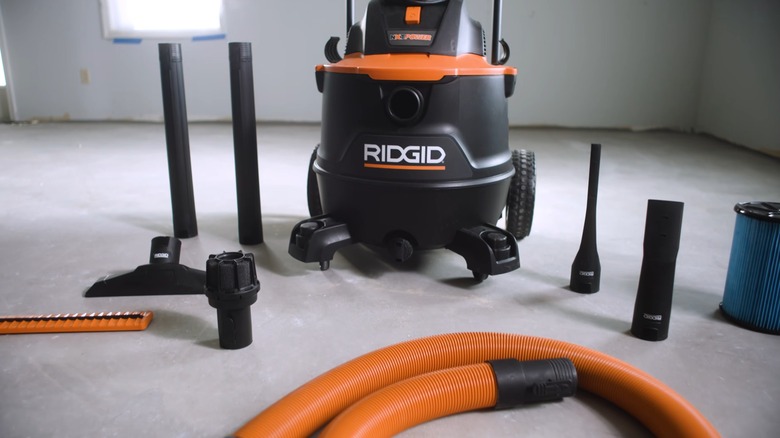 A Ridgid vacuum kit spread out on the floor.