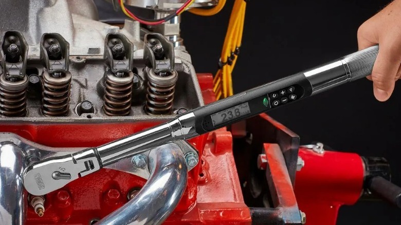Person using Icon ⅜-inch Drive Flex-Head Digital Angle Torque Wrench on an engine block