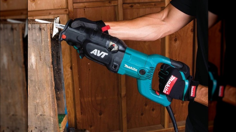 man using pallet saw