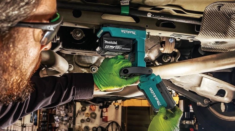 person using Makita magnet light