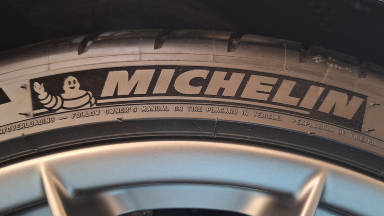 Close-up view of Michelin logo on tire sidewall.