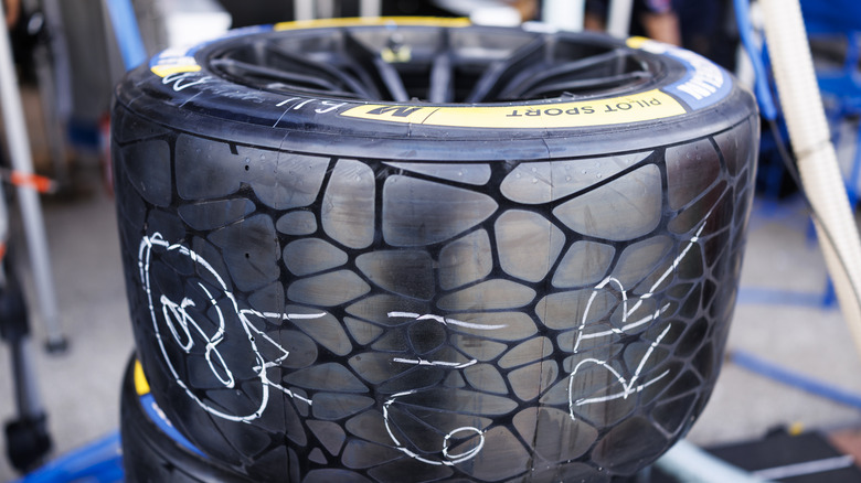 Close-up view of Michelin Pilot Sport Endurance race tire in IMSA paddock.