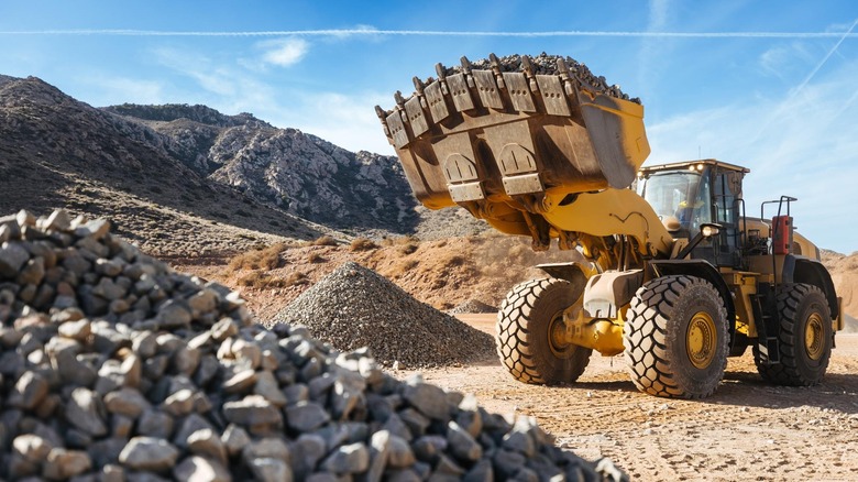 Front 3/4 view of yellow earth move with Michelin XHA3 tires.