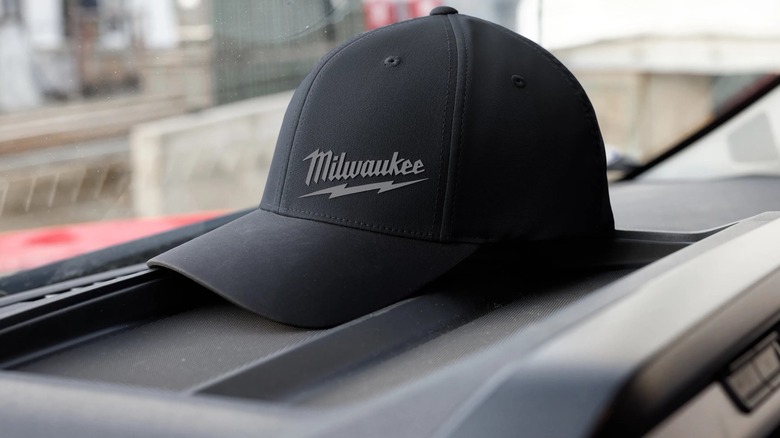 Milwaukee WORKSKIN™ Performance Fitted Hat on a surface.