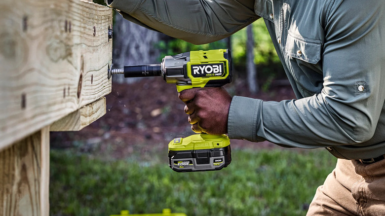 DIYer using a Ryobi 18V One+ HP impact wrench