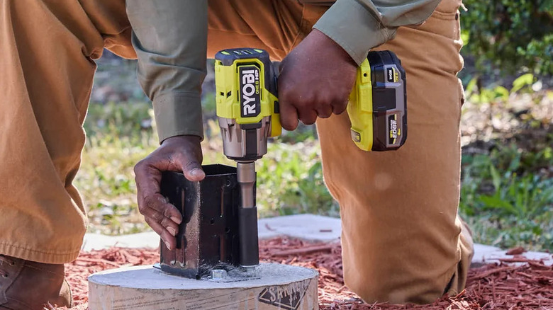 Using a Ryobi 18V One+ HP impact wrench at the jobsite