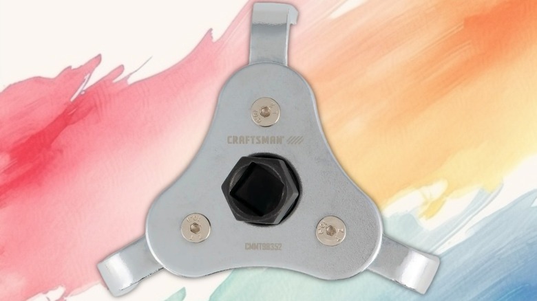 3-Jaw Oil Filter Wench on a painted background.