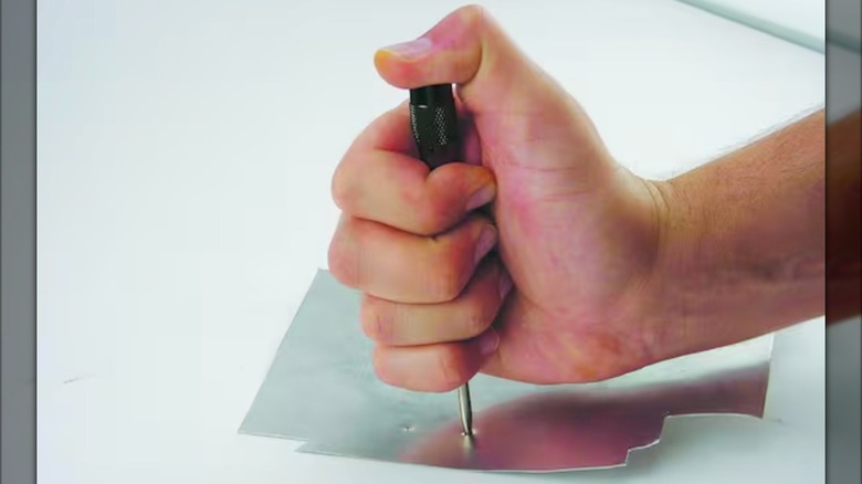 Husky 6-inch Automatic Center Punch in use