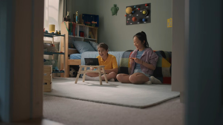 Two people playing the Nintendo Switch 2 with Joy-Cons.