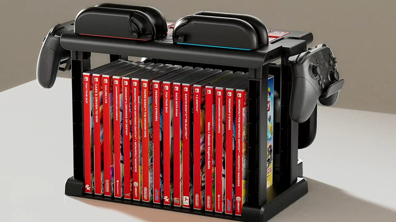 A Switch 2 organizer showing game boxes lined up along with four Joy-Cons and two Pro Controllers.