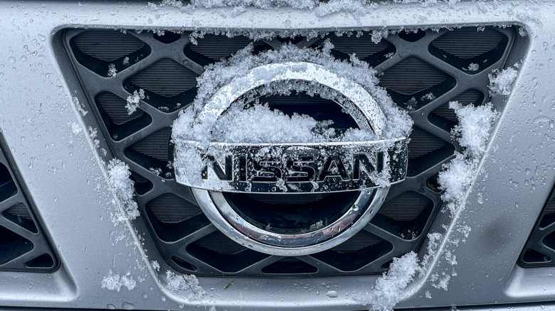 Nissan logo covered in snow