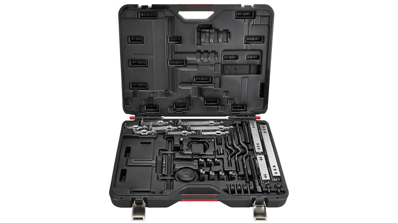 A black box holding a master interchangeable puller set