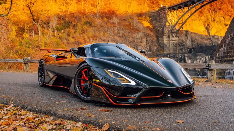 A black and orange 2020 SSC Tuatara parked