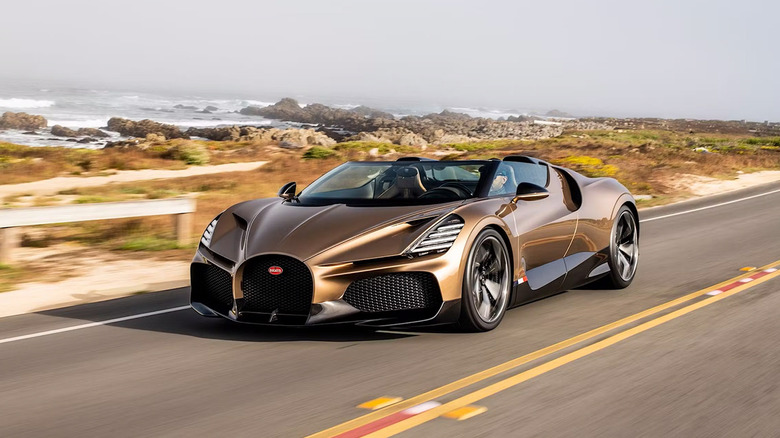 A gold 2022 Bugatti Mistral driving