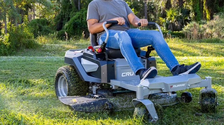 Man mowing lawn on a Murray zero-turn mower