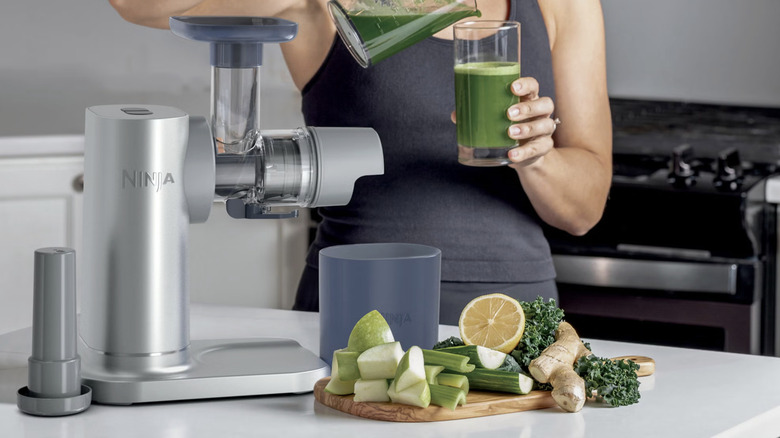 woman making juice with Ninja NeverClog