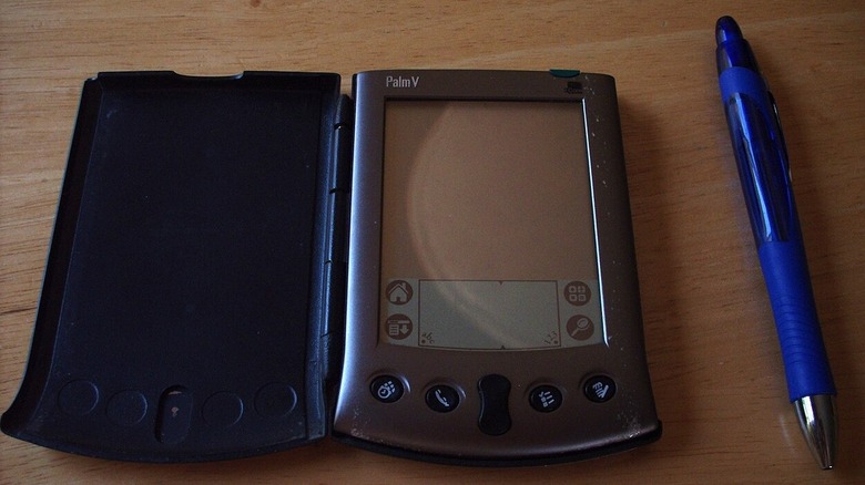 PalmPilot next to a pen