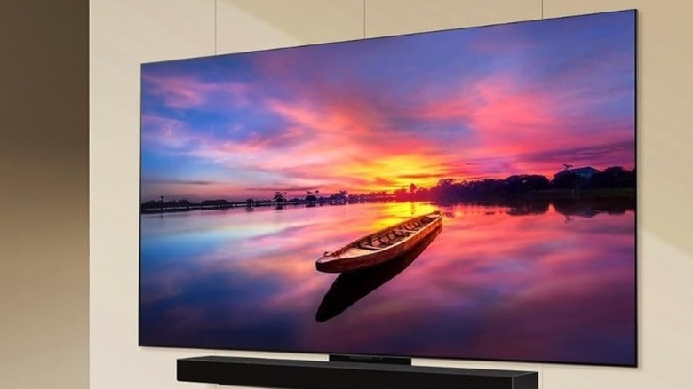 LG 42-Inch C4 OLED mounted over sound bar on the wall