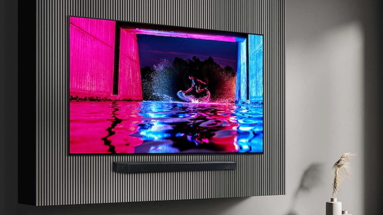 Samsung 77-inch OLED S90D hanging on wall in living room