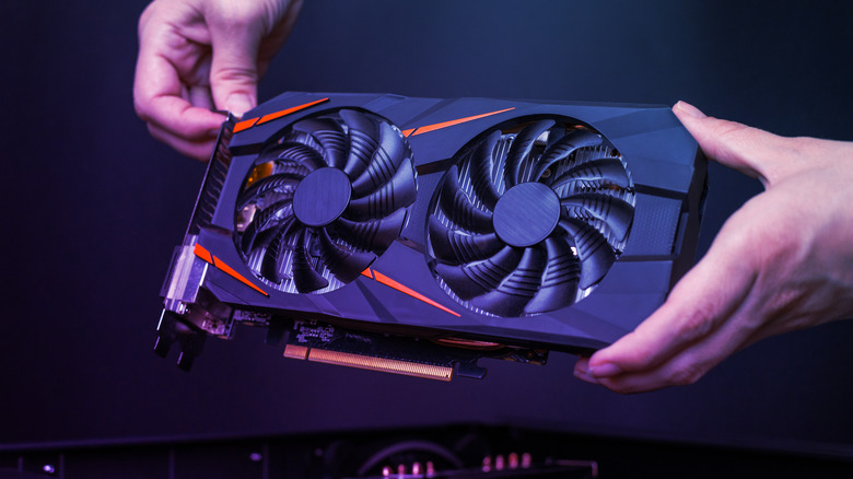 person holding gpu