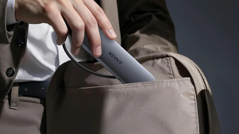 Person carrying an Anker USB-C hub in a bag.