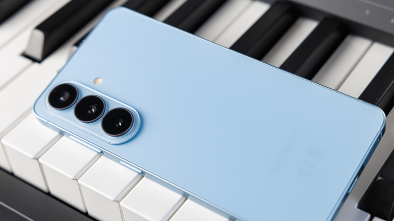 A blue Galaxy S26 on a piano.