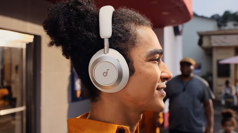 Person wearing the Soundcore Space One Pro headphones.
