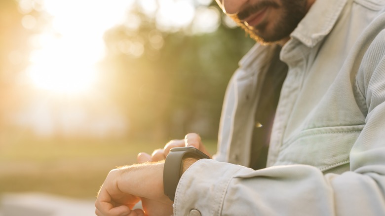 man using apple watch