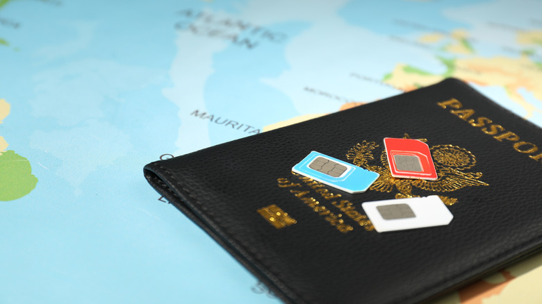Passport on map with SIM cards