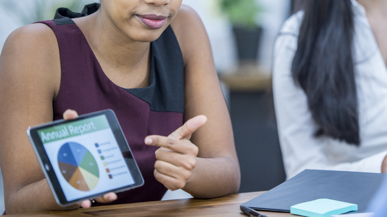 woman showing presentation on phone