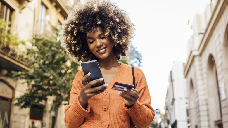 woman shopping online in street