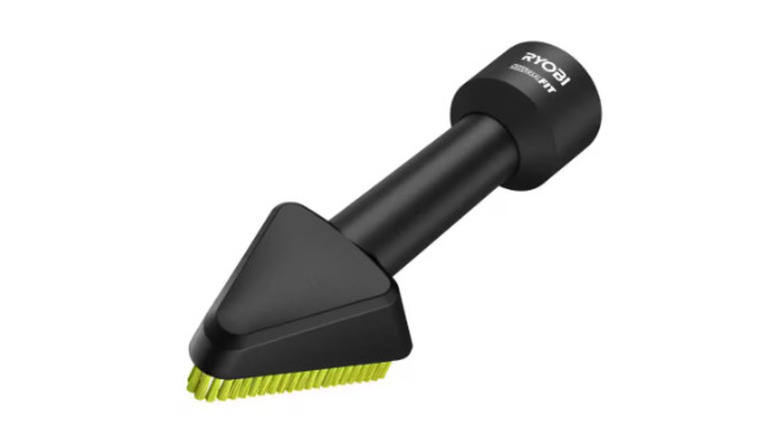 A Ryobi black dust brush vacuum attachment with green bristles on a white background.