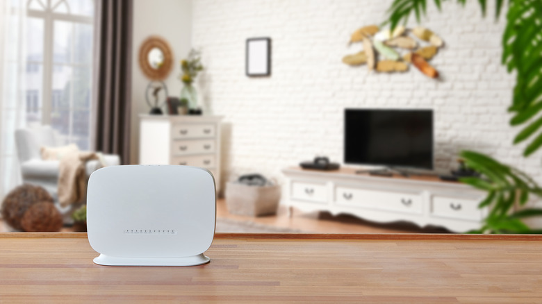 White modem on a wooden surface in a modern living room