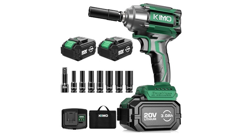 A green and black impact wrench branded Kimo next to two batteries and various sockets.
