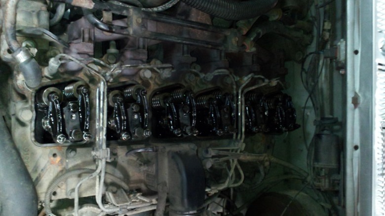 A 5.9L 12-Valve Cummins engine with the valvetain exposed