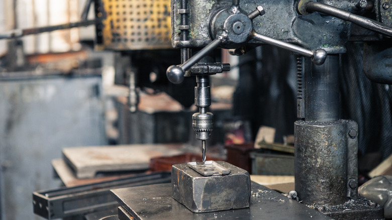 a vintage drill press