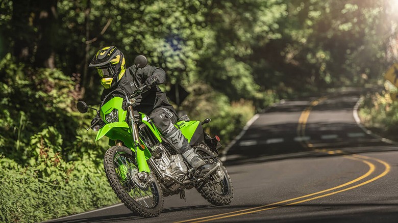 person riding kawasaki klx 300