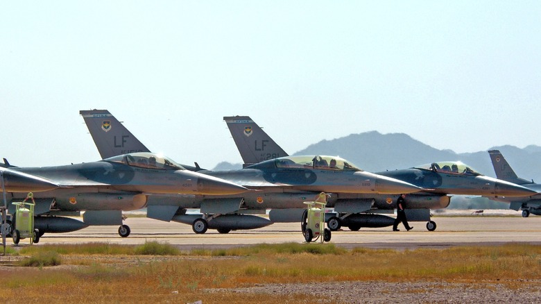 U.S. Air Force F-16s awaiting take-off on a flight strip