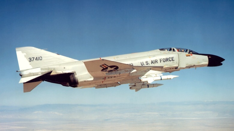 An F-4C Phantom II flying over the desert