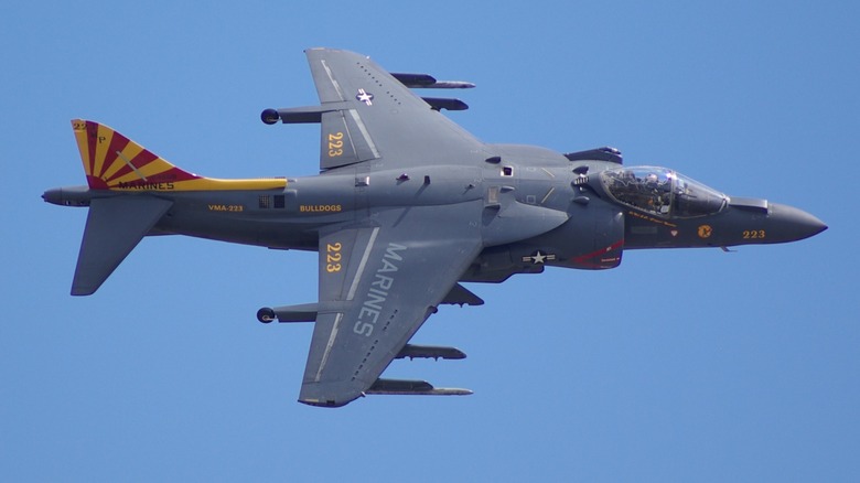 An AV-8B Harrier II flying over blue skies at an air show in 2026