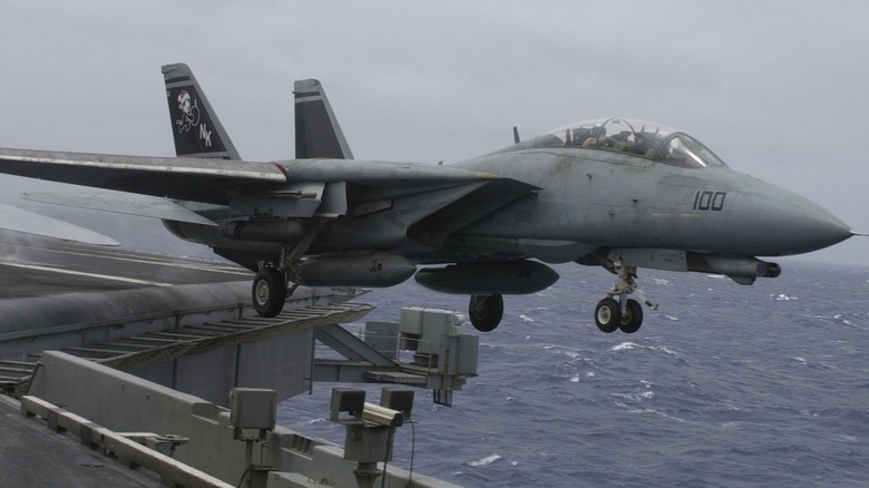 An F-14 Tomcat taking off from the deck of an aircraft carrier